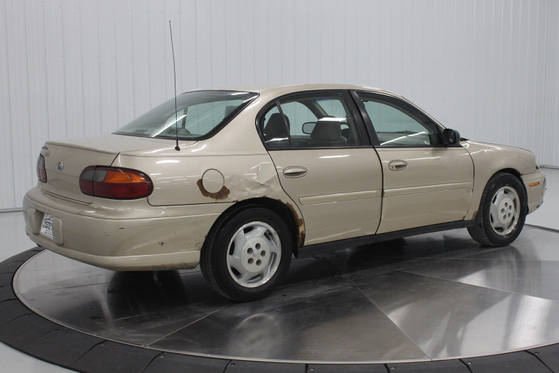 Illustration for article titled Even Rusty Beater Geo Prizms Deserve Nice Photo Shoots At The Dealership